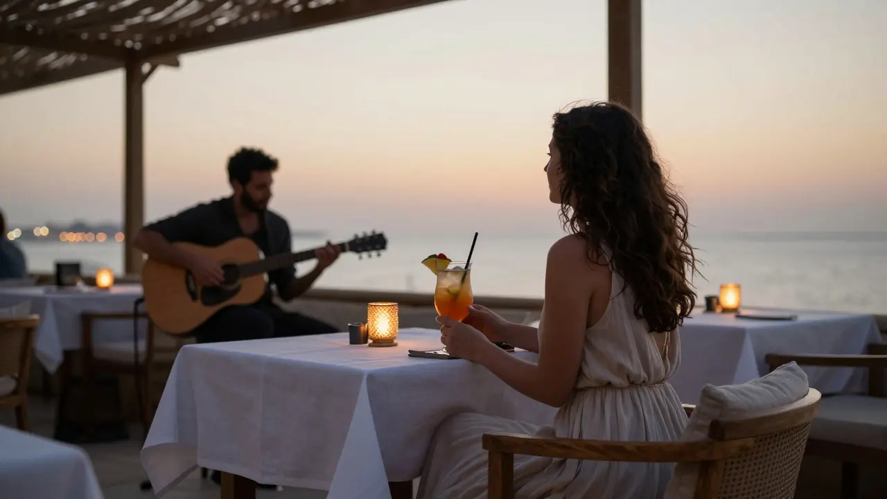 A woman alone at a minimalist bar at sunset, sipping a mocktail as a guitarist plays nearby.